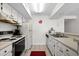 Well-equipped kitchen featuring white cabinets and appliances at 2500 N Ocean Blvd. # 616, North Myrtle Beach, SC 29582