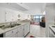 Kitchen with double sink and view into living room at 2500 N Ocean Blvd. # 616, North Myrtle Beach, SC 29582