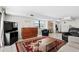 Bright living room with tiled floors, comfy seating, and a large TV at 2500 N Ocean Blvd. # 616, North Myrtle Beach, SC 29582