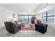 Living room with ocean view, comfortable seating, and tiled floor at 2500 N Ocean Blvd. # 616, North Myrtle Beach, SC 29582