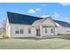 House with covered patio and grassy backyard at 1409 Crooked Hook Rd., North Myrtle Beach, SC 29582