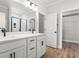 Bathroom with double vanity, quartz countertops and a walk-in shower at 1409 Crooked Hook Rd., North Myrtle Beach, SC 29582