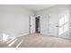 Well-lit bedroom with double doors and carpet at 1409 Crooked Hook Rd., North Myrtle Beach, SC 29582