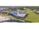 Stunning aerial view of oceanfront property with clubhouse, pool, and lush landscaping at 9318 Cove Dr., Myrtle Beach, SC 29572