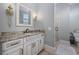 Stylish bathroom featuring a granite countertop vanity, framed mirror, and a glass walk-in shower at 9318 Cove Dr., Myrtle Beach, SC 29572