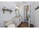 Bathroom featuring shiplap walls, granite countertops, and stylish fixtures at 9318 Cove Dr., Myrtle Beach, SC 29572