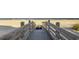Boardwalk leading to a sandy beach with ocean views, offering a scenic pathway for relaxation at 9318 Cove Dr., Myrtle Beach, SC 29572