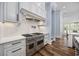 Gourmet kitchen features a high-end stainless steel range and hood at 9318 Cove Dr., Myrtle Beach, SC 29572