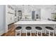 Large kitchen features double islands, hardwood floors, and sleek white cabinets at 9318 Cove Dr., Myrtle Beach, SC 29572