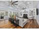 Bright living room with coffered ceilings, fireplace, built-in shelves, and access to outdoor pool at 9318 Cove Dr., Myrtle Beach, SC 29572