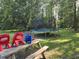 Lovely backyard with a picnic table, lawn chairs and a trampoline for outdoor enjoyment at 938 Fox Hollow Rd., Conway, SC 29526