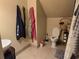 Unique bathroom under the eaves with a modern toilet and convenient storage solutions at 938 Fox Hollow Rd., Conway, SC 29526