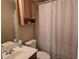 Bathroom featuring a white shower curtain, toilet, and wood-finished vanity with sink at 938 Fox Hollow Rd., Conway, SC 29526