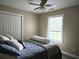 Bedroom with a comfortable bed, white closet doors, and bright natural light from the window at 938 Fox Hollow Rd., Conway, SC 29526