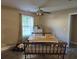 Bright dining area with a wooden table, bench seating, and natural light from a large window at 938 Fox Hollow Rd., Conway, SC 29526