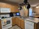 Well-lit kitchen equipped with a dishwasher, oven and ample counter space at 938 Fox Hollow Rd., Conway, SC 29526