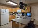 Bright kitchen with oak cabinets, a breakfast bar, and modern appliances at 938 Fox Hollow Rd., Conway, SC 29526