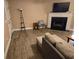View of the living room with a fireplace, tv, flooring, and a comfortable seating area at 938 Fox Hollow Rd., Conway, SC 29526
