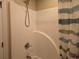 Clean shower with a white surround, adjustable shower head, and a blue and white striped shower curtain at 938 Fox Hollow Rd., Conway, SC 29526