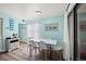 Comfortable dining area adjacent to sliding glass doors, providing natural lighting at 501 Maison Dr. # B10, Myrtle Beach, SC 29572
