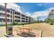 Exterior shot of the condo, showcasing well-maintained grounds and inviting outdoor seating area at 501 Maison Dr. # B10, Myrtle Beach, SC 29572