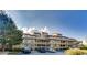 Exterior shot of multi-story condo building with ample parking and stairs to the units on upper floors at 501 Maison Dr. # B10, Myrtle Beach, SC 29572