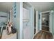 Hallway with laundry and a partial view into the dining room and bathroom at 501 Maison Dr. # B10, Myrtle Beach, SC 29572