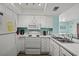 Compact kitchen with essential appliances, white cabinetry, and a practical layout at 501 Maison Dr. # B10, Myrtle Beach, SC 29572