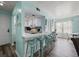 Inviting kitchen area featuring counter seating and views into the adjacent living space at 501 Maison Dr. # B10, Myrtle Beach, SC 29572