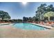 Large outdoor pool with clear blue water, surrounded by lounge chairs and lush landscaping at 501 Maison Dr. # B10, Myrtle Beach, SC 29572
