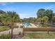 Outdoor swimming pool and sundeck with lounge chairs and palm trees, perfect for relaxation at 501 Maison Dr. # B10, Myrtle Beach, SC 29572