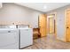 Laundry room with washer, dryer and built-in shelving at 1270 Circle Bay Dr., Longs, SC 29568