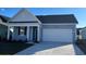 Charming single-story home with a two-car garage and a welcoming front porch at 551 Duvall St., Longs, SC 29568