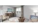 Cozy and bright living room featuring lots of natural light and neutral colored furnishings at 559 Duvall St., Longs, SC 29568