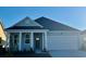 Charming single-Gathering home with a two-car garage and inviting light blue exterior at 567 Duvall St., Longs, SC 29568