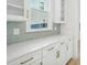 Bright kitchen features white cabinets, granite countertops, and a stylish backsplash at 1035 Milford Way, Myrtle Beach, SC 29588