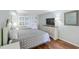 Well-lit bedroom with a queen-sized bed, wood floors, and stylish decor, creating a relaxing and inviting space at 2000 N Ocean Blvd. # 1612, Myrtle Beach, SC 29577