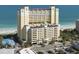 Beautiful high-rise condo building with light yellow paint near the beach and features a parking garage at 2000 N Ocean Blvd. # 1612, Myrtle Beach, SC 29577