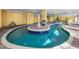 Relaxing indoor pool with tranquil water feature in a well lit and tiled pool area at 2000 N Ocean Blvd. # 1612, Myrtle Beach, SC 29577