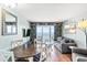 Contemporary living area featuring a comfortable sofa, wood floors, ocean view, and beach-themed decor at 2000 N Ocean Blvd. # 1612, Myrtle Beach, SC 29577