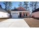 Charming coral-colored house with white trim and stone accents at 3123 Tiger Tail Rd., Conway, SC 29526