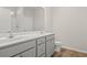 Bathroom featuring double sinks, gray cabinets, and modern fixtures at 371 Lifestyle Court, Surfside Beach, SC 29575