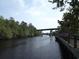 Serene river view with bridge and wooden boardwalk at 371 Lifestyle Court, Surfside Beach, SC 29575