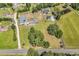 An aerial view of a home with a long driveway and multiple outbuildings on a large plot of land at 3747 Bakers Chapel Rd., Aynor, SC 29511