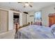 Bedroom with blue quilt, furniture, and ceiling fan at 3747 Bakers Chapel Rd., Aynor, SC 29511
