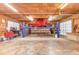 Spacious garage workshop with a car lift, providing ample space for repairs and storage at 3747 Bakers Chapel Rd., Aynor, SC 29511