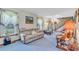 Cozy living room featuring a plush sofa, soft carpeting, and abundant natural light for a welcoming atmosphere at 3747 Bakers Chapel Rd., Aynor, SC 29511