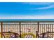 Serene balcony view overlooking a sun-soaked beach and the ocean at 6900 N Ocean Blvd. # 812, Myrtle Beach, SC 29572