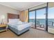 Comfortable hotel bedroom with sliding glass doors to an ocean view balcony at 6900 N Ocean Blvd. # 812, Myrtle Beach, SC 29572