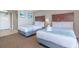 Hotel bedroom with two queen beds, carpeted floors, and coastal decor at 6900 N Ocean Blvd. # 812, Myrtle Beach, SC 29572